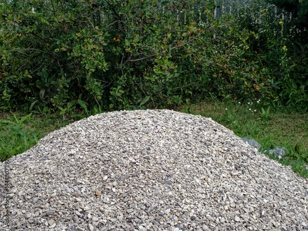 Obraz Pile of fine white rubble in the yard of a rural house