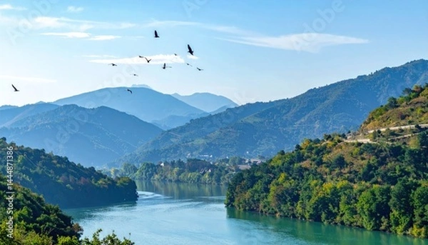 Fototapeta Birds flying over mountain ranges and rivers, vibrant and harmonious nature background