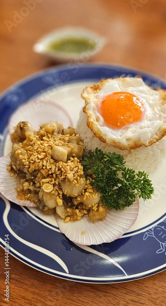 Fototapeta Stir-fried Scallops with garlic with streamed rice serving on blue plate