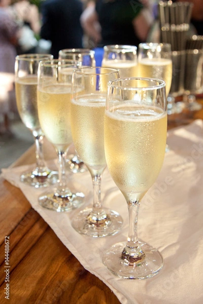 Fototapeta Champagne Flutes on a table