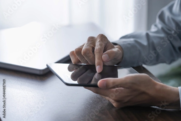 Obraz Businessman using digital tablet create business idea at home office