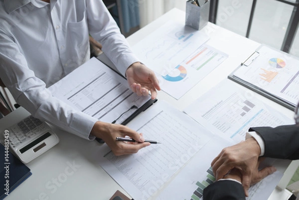 Fototapeta Financial inspector calculating a numbers in office room