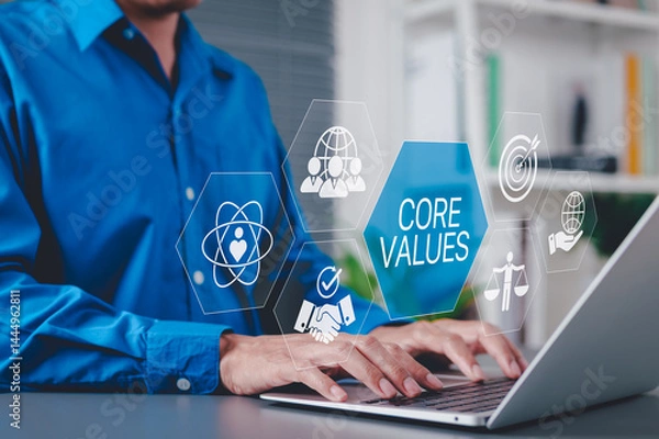 Obraz Core Values and Corporate Ethics Concept. Businessman using laptop with icons representing core values such as integrity, teamwork, ethics, company culture, principles guide, purpose, responsibility,