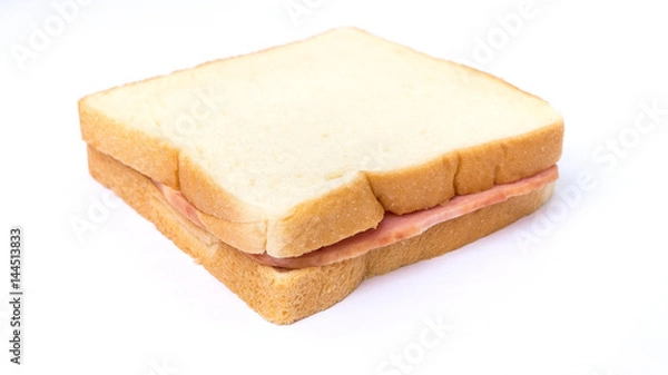 Fototapeta sliced white bread with ham sandwich on white background