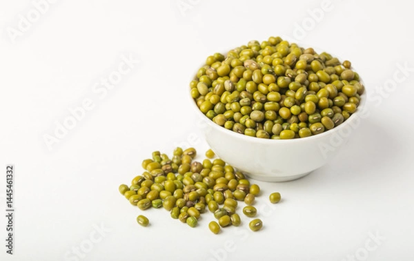 Fototapeta White bowl full of mung beans or dal on white background isolated