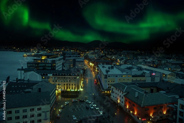 Fototapeta Bodø, a city north of the Arctic Circle, offers stunning views of the aurora borealis. The Northern Lights dance across the night sky, creating a magical spectacle.