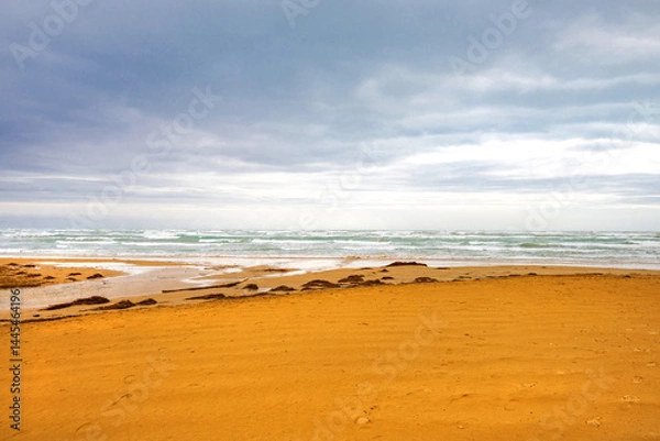 Fototapeta View of the Italian town of Vieste during a storm and cloudy weather. Sad atmosphere of the popular holiday destination Vieste.