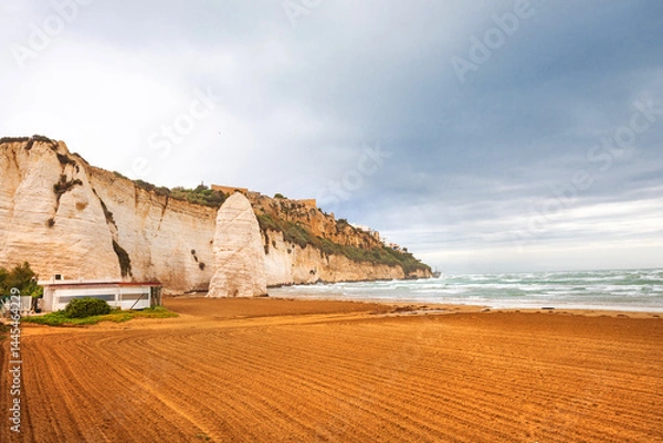 Fototapeta View of the Italian town of Vieste during a storm and cloudy weather. Sad atmosphere of the popular holiday destination Vieste.
