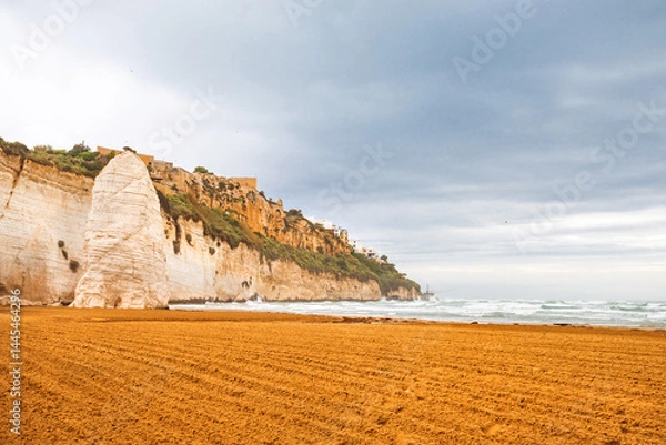 Fototapeta View of the Italian town of Vieste during a storm and cloudy weather. Sad atmosphere of the popular holiday destination Vieste.