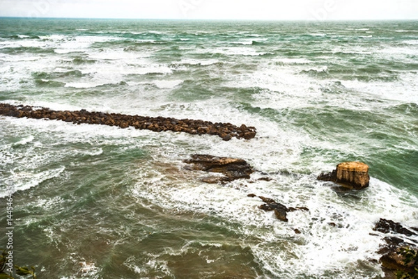 Fototapeta View of the Italian town of Vieste during a storm and cloudy weather. Sad atmosphere of the popular holiday destination Vieste.