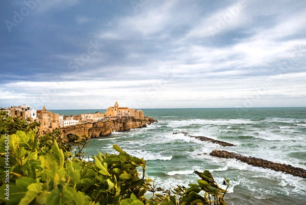 Fototapeta View of the Italian town of Vieste during a storm and cloudy weather. Sad atmosphere of the popular holiday destination Vieste.