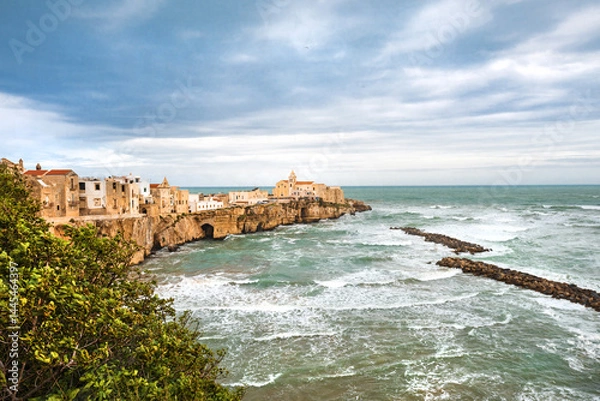 Fototapeta View of the Italian town of Vieste during a storm and cloudy weather. Sad atmosphere of the popular holiday destination Vieste.