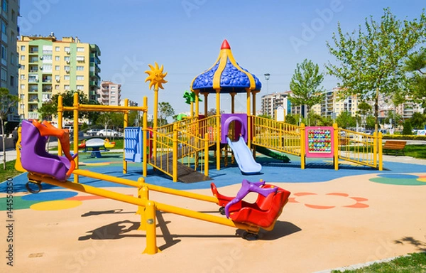 Fototapeta Playground in public park. Colorful playground for children.