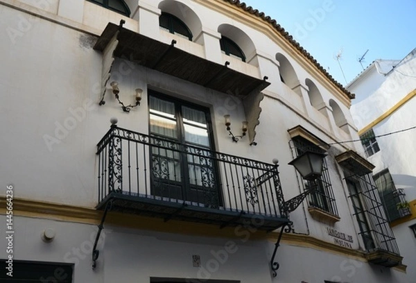 Obraz The exterior of a historical residential building with balconies in Seville, Andalusia, Spain