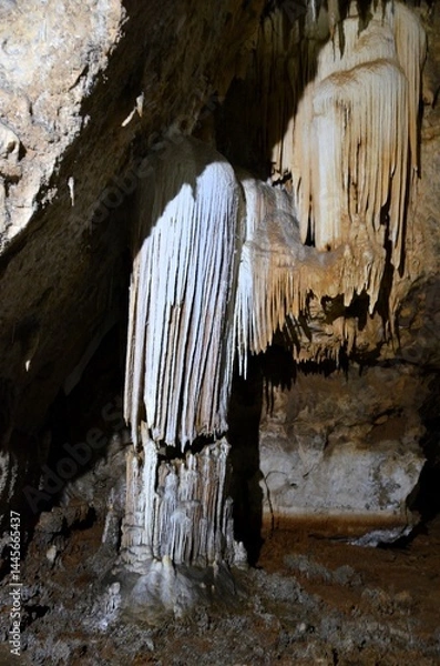 Obraz Inside of beautiful old dark cave with many stalactites. Grotte di Is Zuddas, Italy, Sardinia
