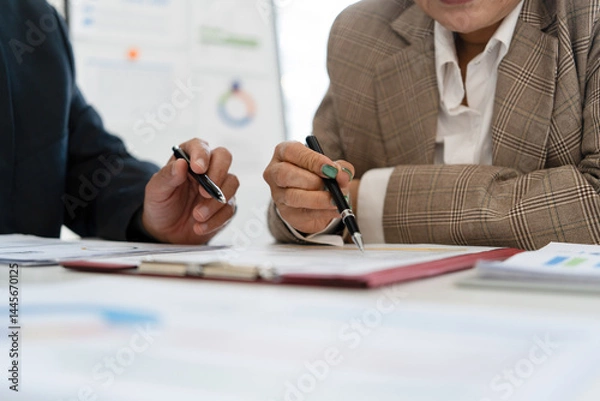 Obraz Senior businessmen analyzing data together.