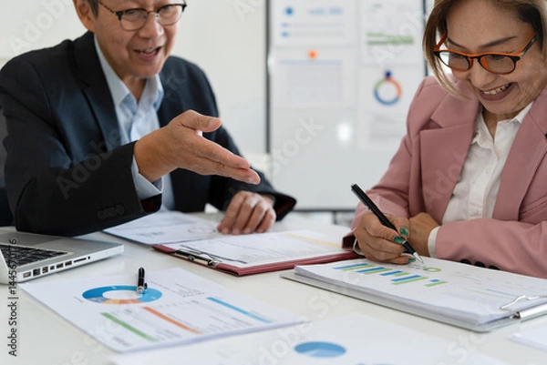 Obraz Senior businessmen analyzing data together.