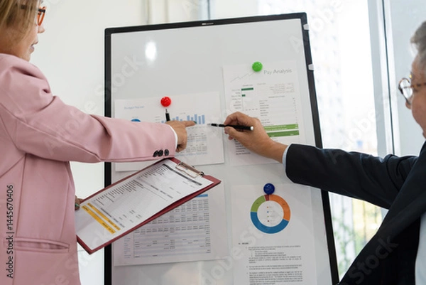 Obraz Senior businessmen analyzing data.