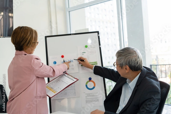 Obraz Senior businessmen analyzing data.