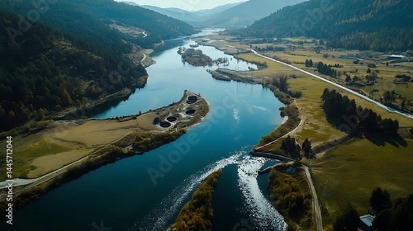 Fototapeta Aerial View Of A River With Hydroelectric Stations Powering A Small Rural Community In The Countryside