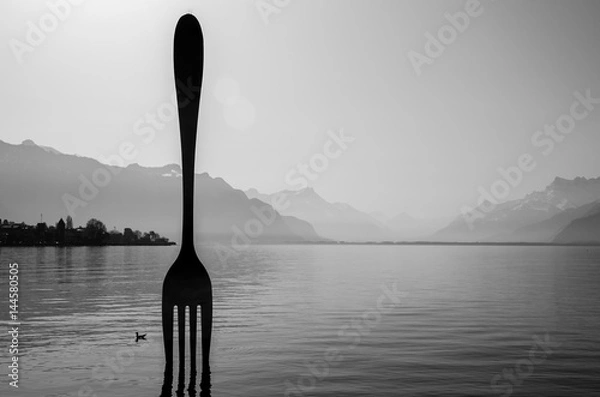 Obraz A scene of Geneva lake in black-white tone with giant fork in the middle in Vevey town