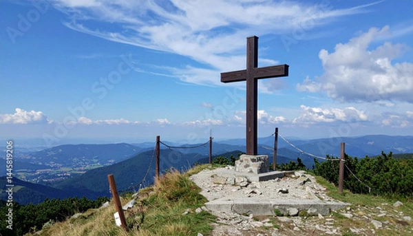 Fototapeta Background containing a big cross standing on the top of a mountain