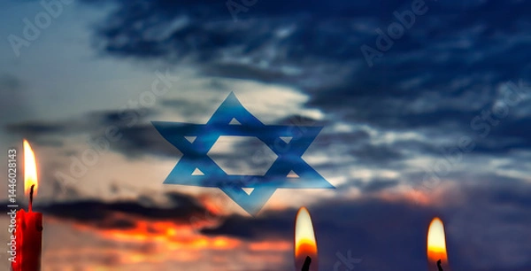 Obraz Memorial and Day of Remembrance of the Fallen, flag with Star of David and lit candles. Dramatic sky background. Only my own photos and traditional digital tools were used