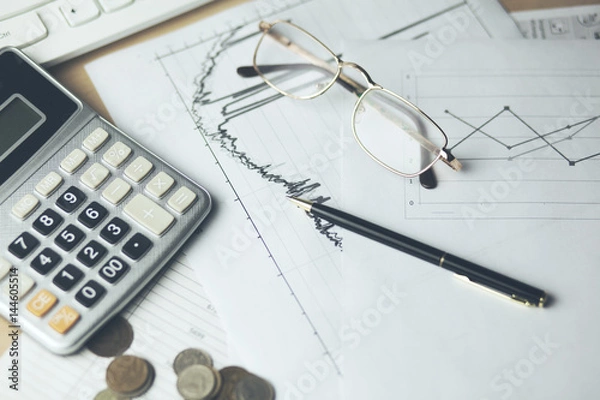 Fototapeta calculator with document and coins