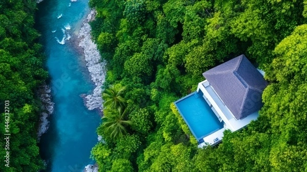 Fototapeta Secluded Jungle Villa with Infinity Pool - Luxury villa nestled in lush rainforest, featuring a private infinity pool overlooking a vibrant river. Tranquil escape