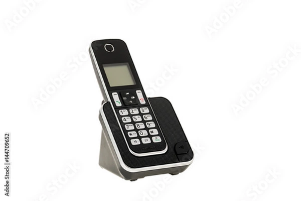 Fototapeta modern cordless landline dect phone with charging station isolated on white with clipping path. Design element