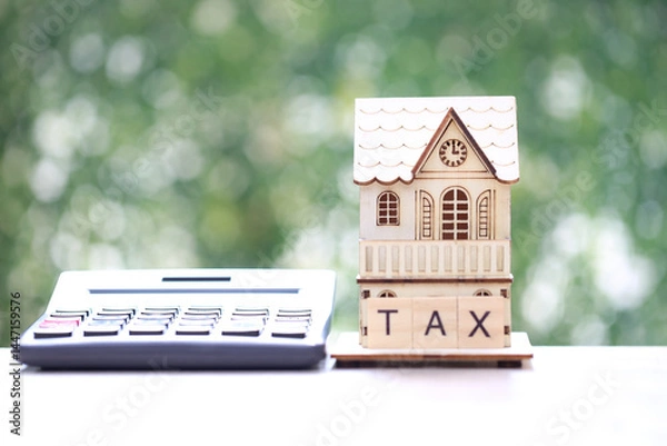 Fototapeta Estate tax,Model house and calculator with tax word on natural green background,Business investment and Property tax concept