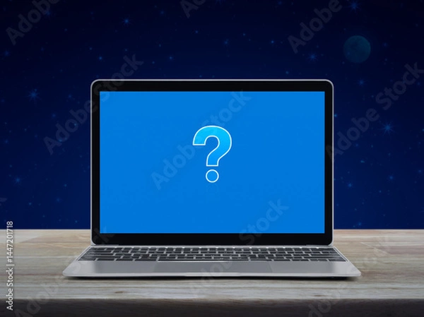 Obraz Question mark sign icon on modern laptop computer monitor screen on wooden table over fantasy night sky and moon, Business customer service and support online concept