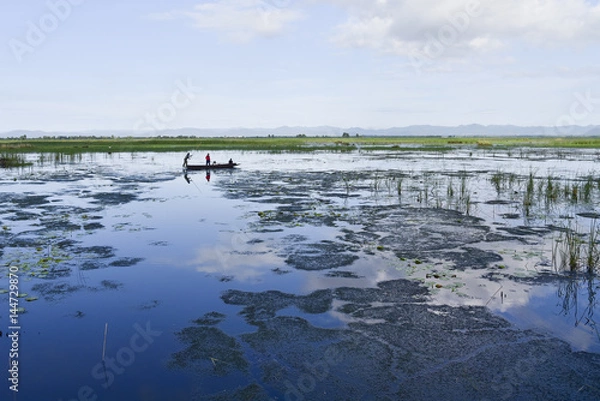 Fototapeta Fisherman's life on lagoon.

