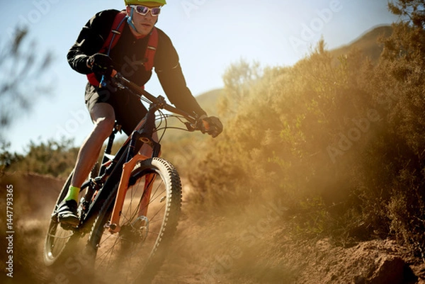 Fototapeta Nature, sports and athlete on dirt road trail for gravel race, challenge or competition training. Fitness, mountain bike and man cyclist riding in mud outdoor for exercise or workout with speed.