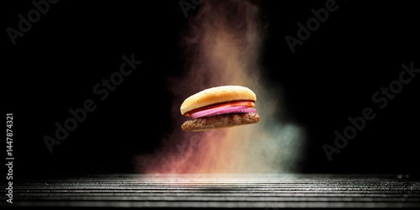 Fototapeta Hamburger with Tomato and Onion over Grill