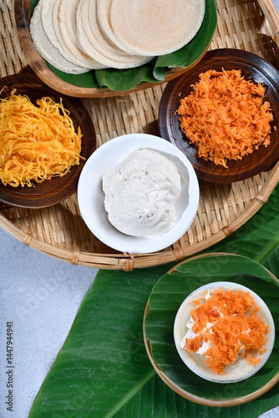 Obraz Vertical top view of Thai crispy pancakes topped with strips of egg yolks setup scenc