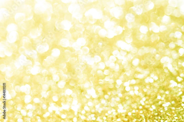 Fototapeta Gold bokeh texture. Festive glitter background with defocused lights