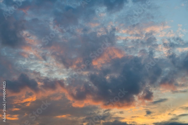 Obraz Pink and grey clouds in the sunset sky
