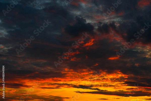 Obraz Orange, red and black clouds in the sunset sky