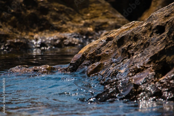 Fototapeta Beautiful seashore with breakwater and large stones