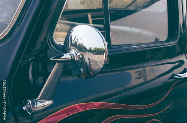 Fototapeta close up of classic vintage car side with rear view mirror. side mirror of a vintage car,