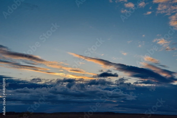 Fototapeta Central Kazakhstan. An unusually gloomy dramatic sunset with dark clouds.