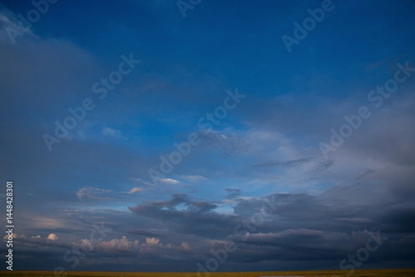 Fototapeta Central Kazakhstan. An unusually gloomy dramatic sunset with dark clouds.