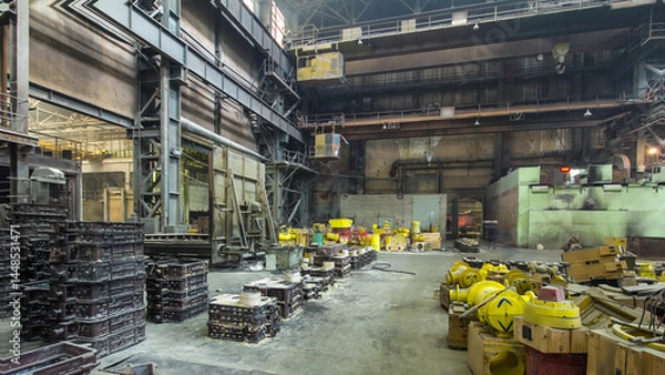 Fototapeta The liquid metal is poured into molds at the metallurgical plant timelapse hyperlapse.