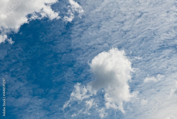 Obraz Fluffy white clouds in the blue sky