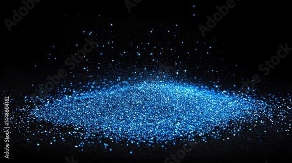 Obraz A vibrant, concentrated blue glitter explosion on a dark surface.
