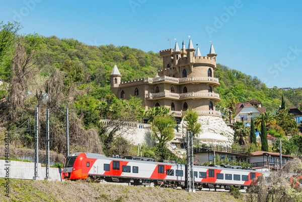 Obraz Passenger train moves along the mountain.