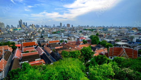 Fototapeta Aerial cityscape view with red temple roofs and skyline