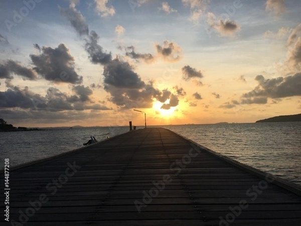 Fototapeta Wooden walkway bridge along the beach,Beach, rocky beach, beautiful beach, wooden bridges, wooden bridges along the beach, Koh Kham, Kham island, Sattahip, Chonburi, Thailand.