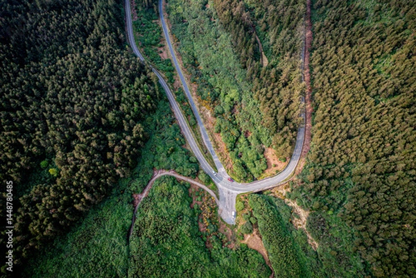 Fototapeta  Aerial view of The Vee Pass winding through the Knockmealdown Mountains, showcasing stunning Irish landscape, vibrant greenery, and dramatic elevation in County Tipperary, Ireland.